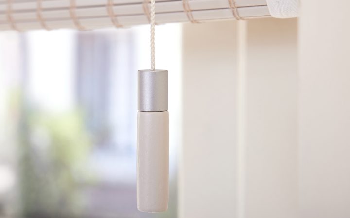 Koordtassel van een witte Woodweave blind